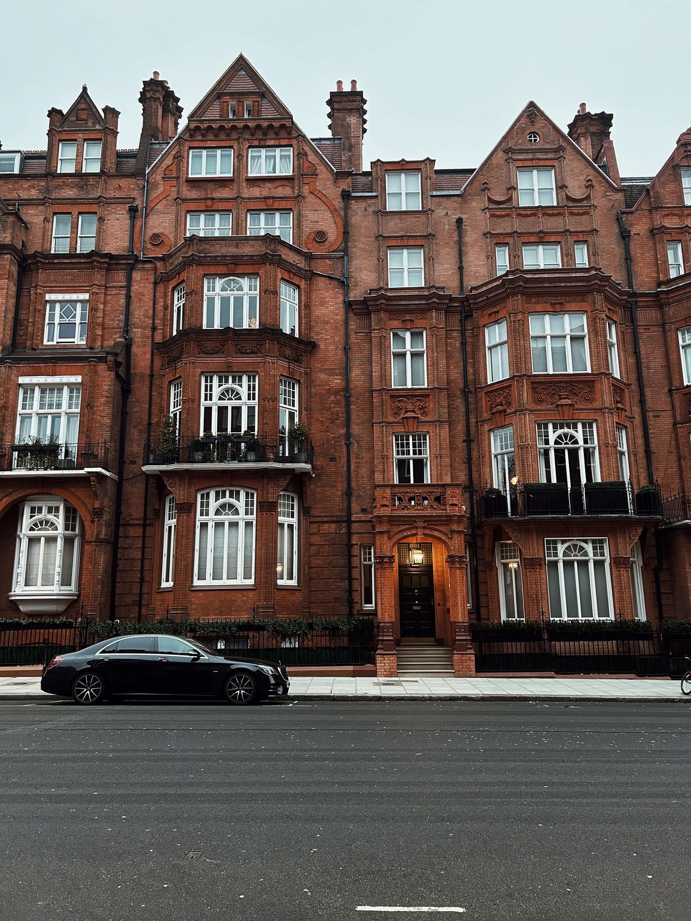 Red brick Edwardian mansion blocks on a London street